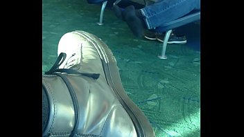 mature dude sockplay in airport terminal