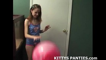 18yo Kitty playing with a puzzle in a miniskirt